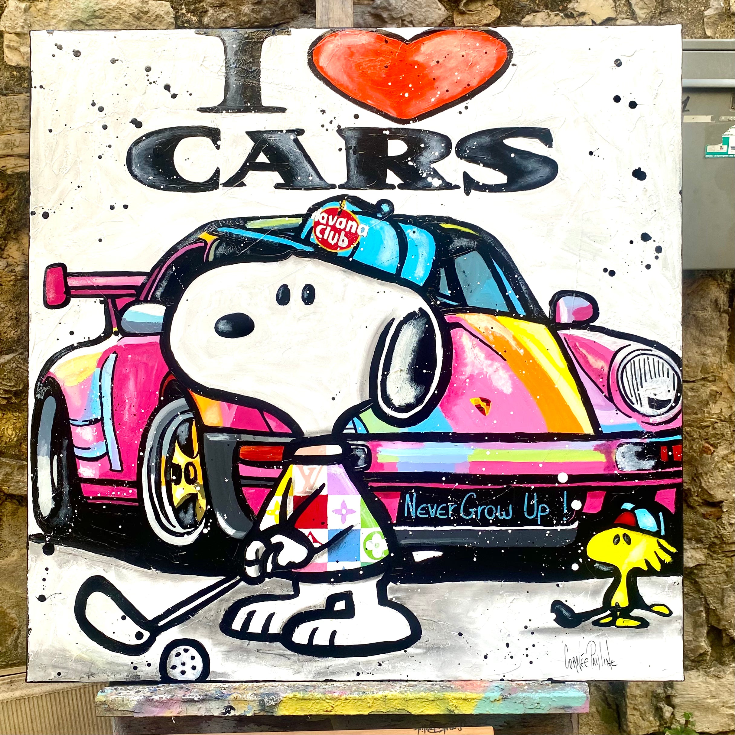 Snoopy plays golf next to Porsche
