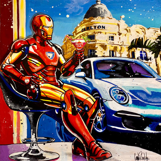 Iron Man enjoys a cocktail next to Porsche